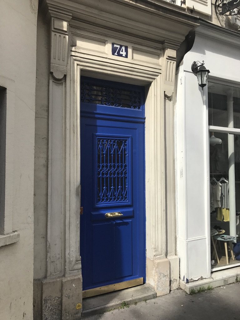 A blue door numbered 74 on rue du Cardinal Lemoine